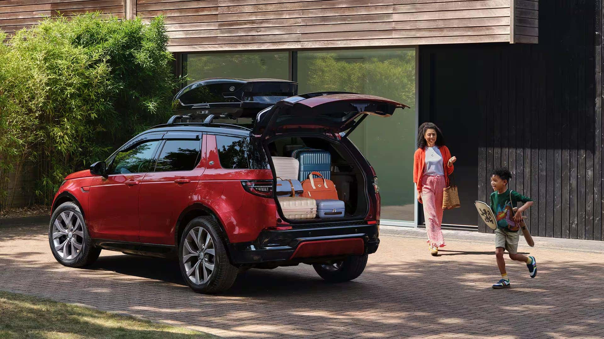 a 2026 Discovery Sport parked in front of a home