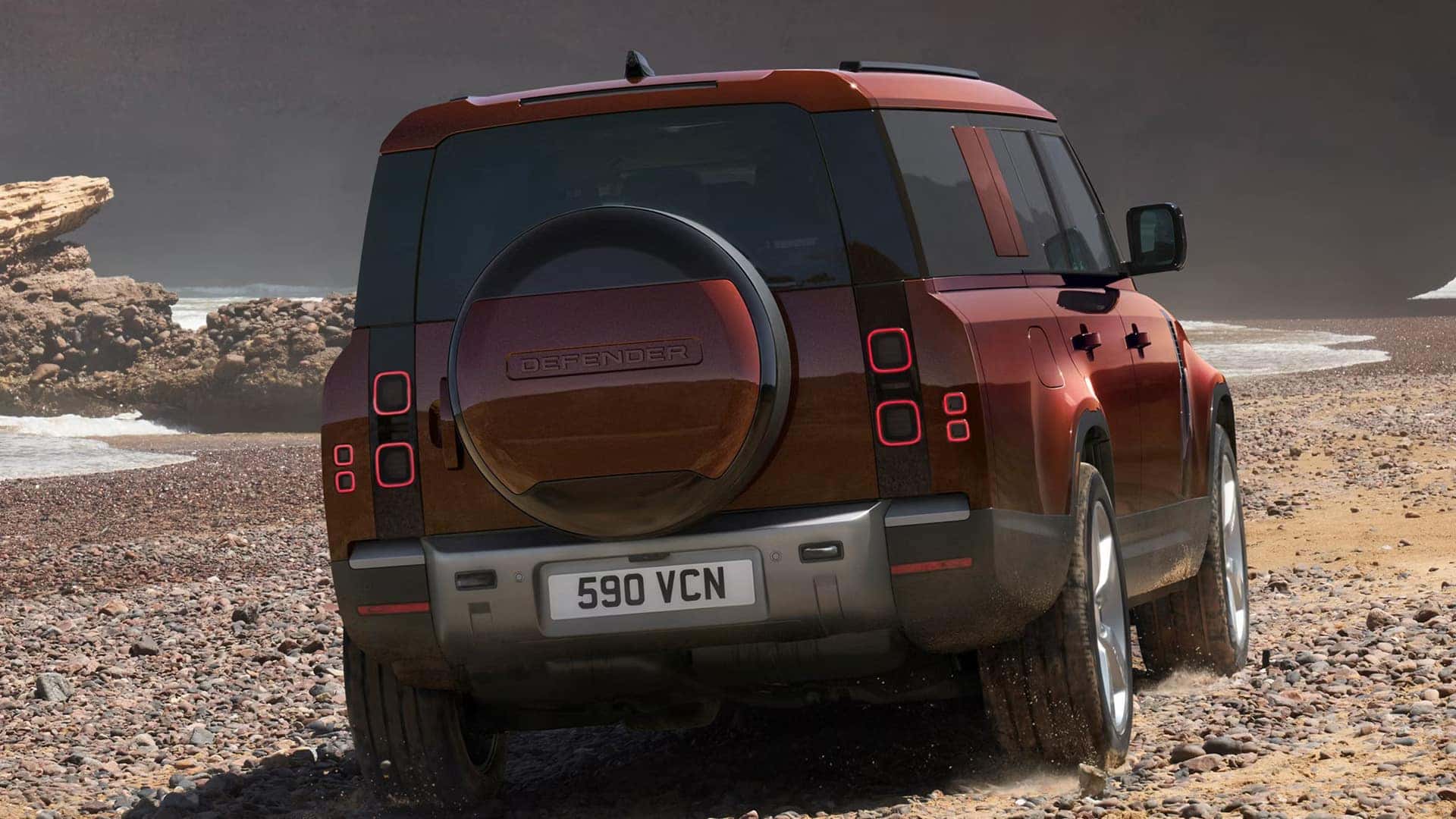 2026 Defender 130 driving on a gravel road