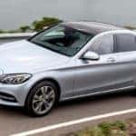 Silver C-Class Hybrid driving on a highway