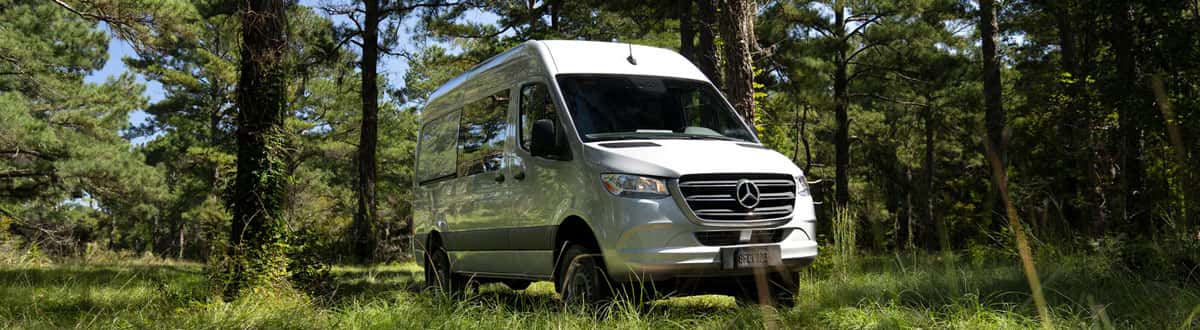 Mercedes-Benz Sprinter Van Parked in Nature