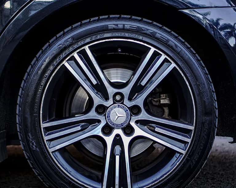 Mercedes-Benz wheel with curb rash before repair