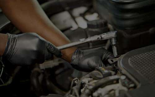 Mercedes-Benz Certified Technician Installing Spark Plugs