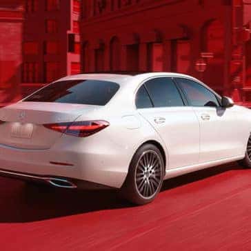White 2023 Mercedes-Benz C-Class With Red Background