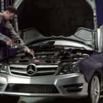 Mechanic Filling Oil in a Mercedes-Benz