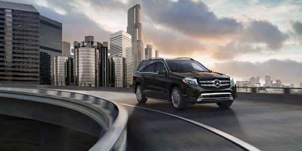 2018 Mercedes-Benz GLS driving on a highway ramp leaving the city