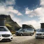 three marco polo camper vans in mountains with tops popped up