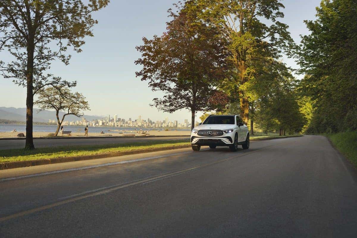 White Mercedes-Benz GLC on a coastal road