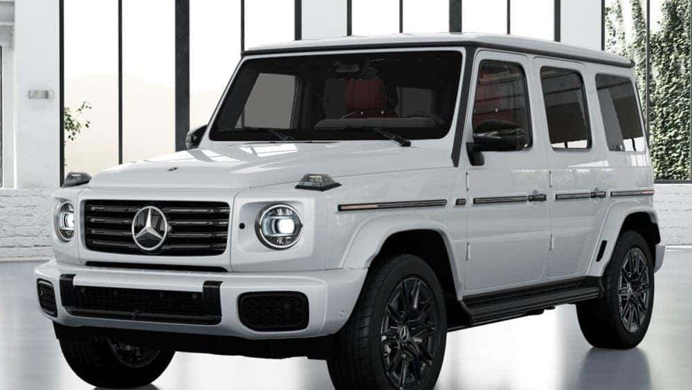 2027 G 580 with EQ Technology, MANUFAKTUR Moonlight White, from our inventory (stock VX100795), front three-quarter view. Optional equipment shown.