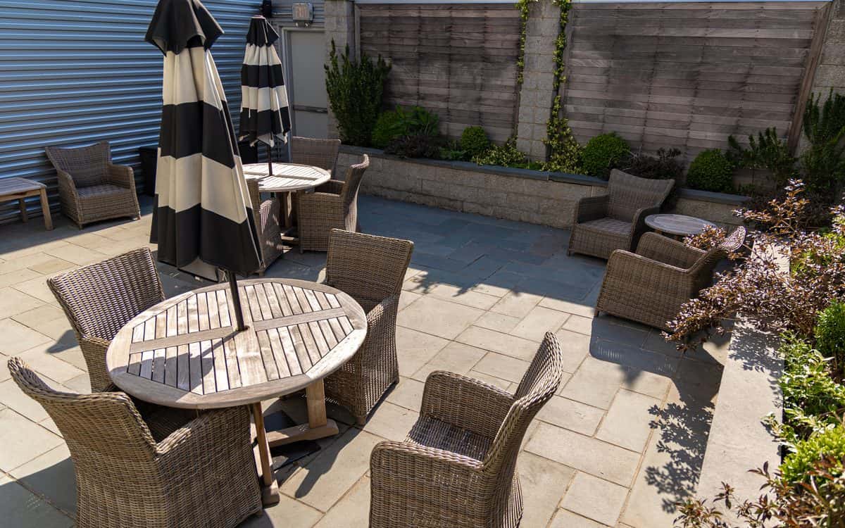 Outdoor patio with tables and umbrellas at the Mercedes-Benz of Rockville Centre Service Center