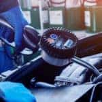 Close up of hands changing oil