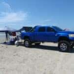 A big, beautiful blue Dodge Ram sporting a BedSlide and a DiamondBack HD