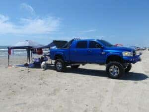 A big, beautiful blue Dodge Ram sporting a BedSlide and a DiamondBack HD