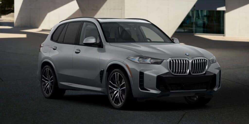 2025 BMW X5 parked in an architectural urban setting with soft shadows and reflections