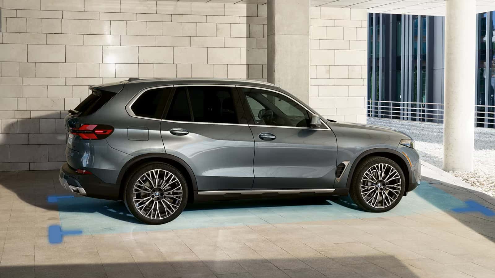 2026 bmw x5 in gray parked next to a building
