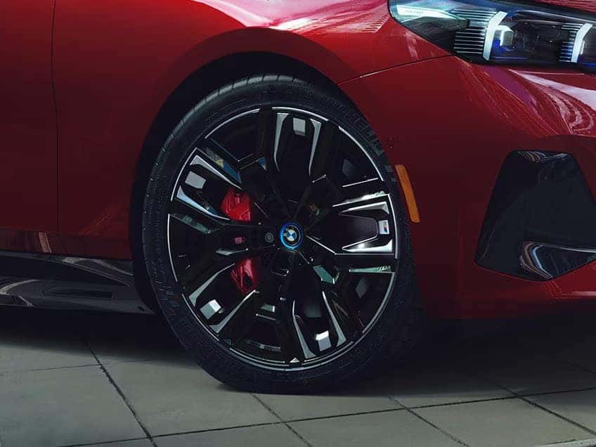 close up of the front tire of a 5 series m5 sedan