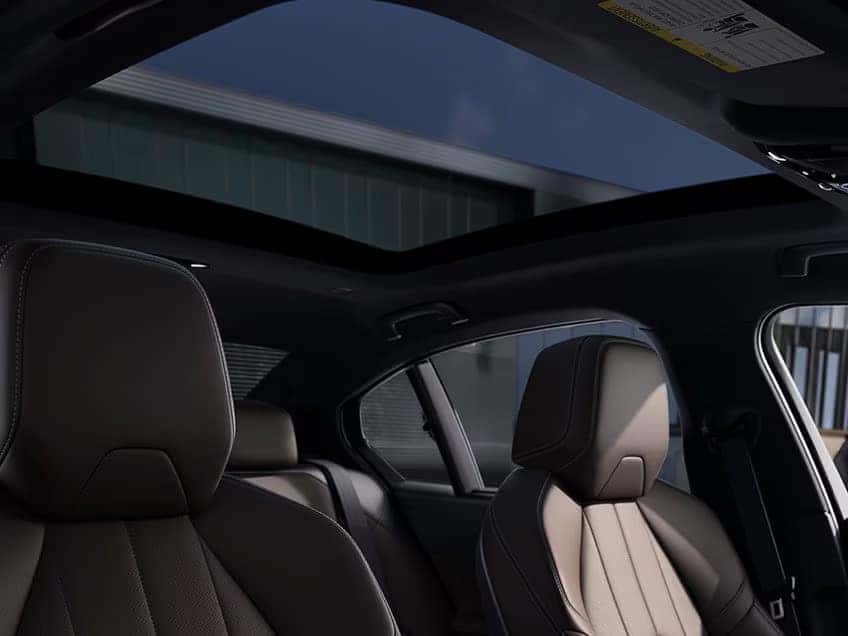 the inside cabin of a bmw 5 series with soft brown leather seats