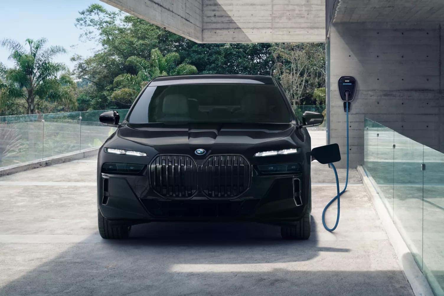 2026 BMW 7 Series plugged into a charger