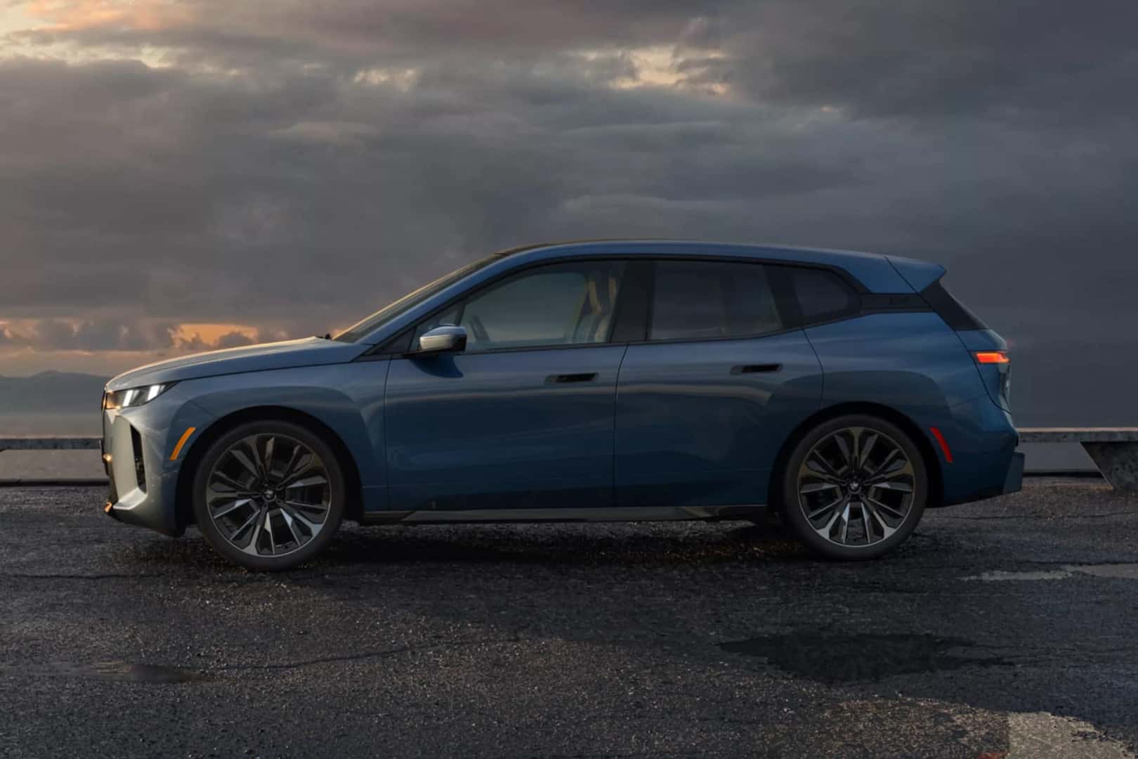 a 2026 BMW iX parked on a road