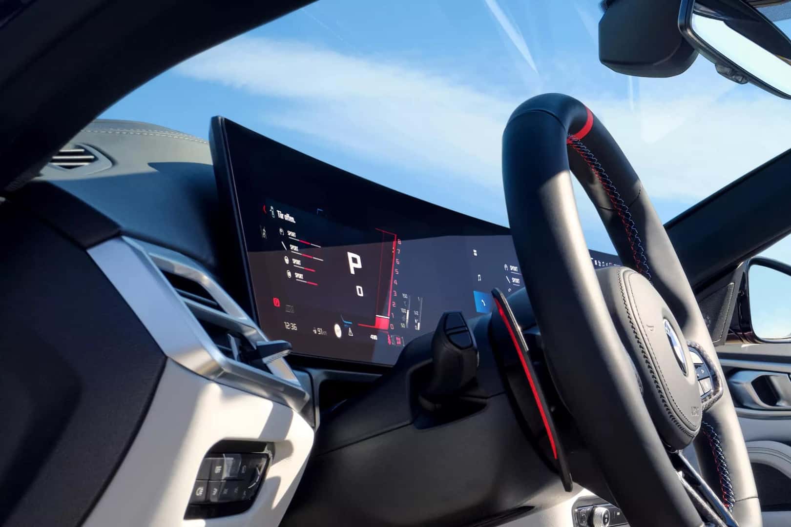 a view of the steering wheel and infotainment system in the new 2026 BMW 4 Series
