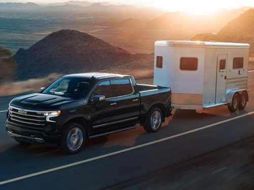New 2024 Chevrolet Silverado 1500 towing a trailer