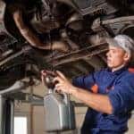 Mechanic draining oil