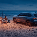 2024 Toyota Grand Highlander parked on a beach at night