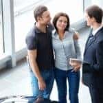 A couple talking with a sales rep about Toyota financing