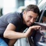 Man admiring luxury car