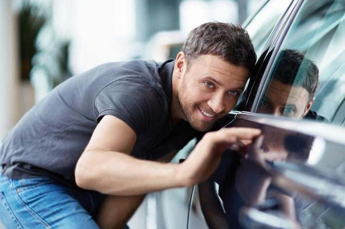 Man admiring luxury car