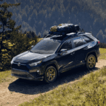 2025 Toyota RAV4 driving on a dirt road