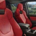 Interior of 2025 Toyota Tacoma with red TRD seats