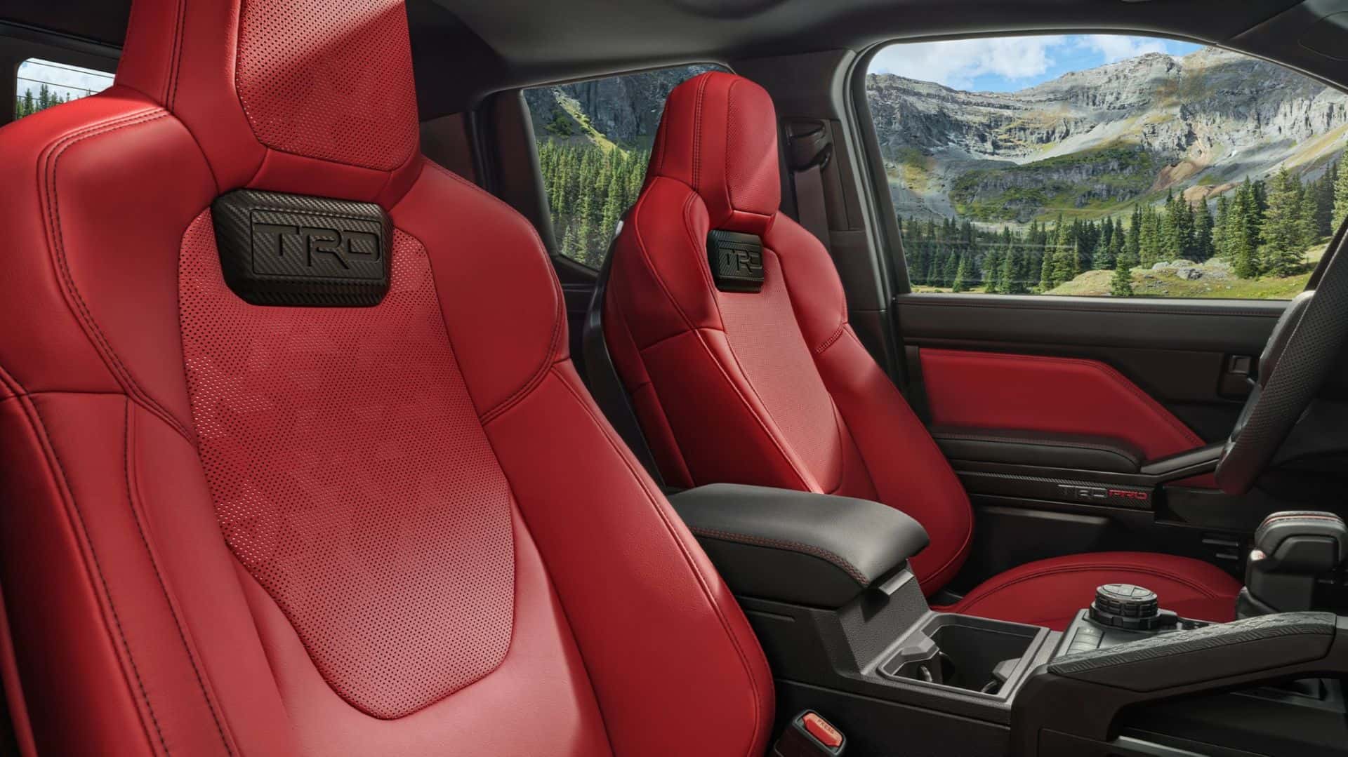 Interior of 2025 Toyota Tacoma with red TRD seats