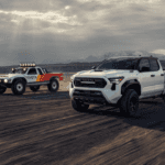 2026 Toyota Tacoma racing a vintage Toyota truck in the desert