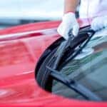 Mechanic replacing windshield wiper blades