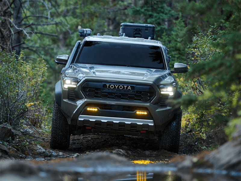 2026 Toyota Tacoma driving in the woods