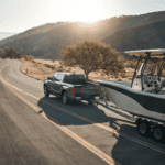 2026 Toyota Tundra towing a boat on the road