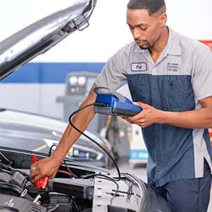 How to prepare your Hyundai for the winter season in Washington, PA at Washington Hyundai | Mechanic checks battery voltage